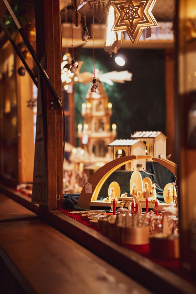 Charming display of artisanal wooden crafts at a cozy Christmas market.